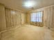 A well lit bedroom with wood paneling and carpet at 8524 Cane Branch Rd, Ruffin, SC 29475