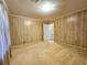 Cozy bedroom featuring wood paneling and carpet flooring at 8524 Cane Branch Rd, Ruffin, SC 29475