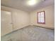 Standard bedroom featuring neutral wall paper, large window, and plush carpeting at 8524 Cane Branch Rd, Ruffin, SC 29475