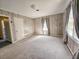 Bedroom featuring one window with gray curtains, wood paneling, carpet, and a ceiling vent at 8524 Cane Branch Rd, Ruffin, SC 29475