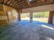 Open garage with view to the backyard, showing an expansive space for parking or projects at 8524 Cane Branch Rd, Ruffin, SC 29475