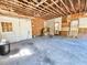 Spacious garage interior with bare walls and ceiling, ready for customization and offering ample storage at 8524 Cane Branch Rd, Ruffin, SC 29475