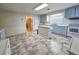 Well-lit kitchen featuring ample counter space, modern appliances, and tiled flooring at 8524 Cane Branch Rd, Ruffin, SC 29475