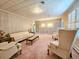 Traditional living room includes neutral furniture, patterned wallpaper and complementary light fixture at 8524 Cane Branch Rd, Ruffin, SC 29475