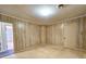 Room featuring wood paneling and carpet flooring at 8524 Cane Branch Rd, Ruffin, SC 29475