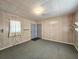 The room features wood paneling, carpet, and two doors at 8524 Cane Branch Rd, Ruffin, SC 29475