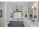 Luxurious bathroom featuring a soaking tub, marble countertops, and modern fixtures at 10044 Randall Rd, McClellanville, SC 29458
