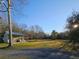 Exterior view of house in a spacious grassy and graveled area at 10044 Randall Rd, McClellanville, SC 29458