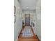 Modern laundry room with hardwood floors, a washer and dryer, and plenty of cabinet space at 10044 Randall Rd, McClellanville, SC 29458