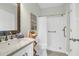 Well-lit bathroom featuring a shower, vanity sink, and a coastal-themed decor for a spa-like retreat at 1012 Rosewood Ln, Mount Pleasant, SC 29464