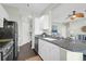 Bright kitchen with granite countertops, stainless appliances, and seamless connection to the living area at 1012 Rosewood Ln, Mount Pleasant, SC 29464