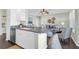 Open kitchen with granite counters flows into living room, perfect for entertaining and modern living at 1012 Rosewood Ln, Mount Pleasant, SC 29464