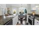 Charming eat-in kitchen features granite countertops, modern appliances, and a sunlit dining area at 1012 Rosewood Ln, Mount Pleasant, SC 29464