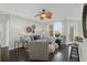 Bright living room features a large window and stylish furnishings, providing a relaxing ambiance at 1012 Rosewood Ln, Mount Pleasant, SC 29464