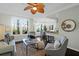 Bright and inviting living area with stylish decor, flowing seamlessly into the kitchen at 1012 Rosewood Ln, Mount Pleasant, SC 29464