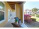 View of condo patio seating area overlooking colorful landscaping and nearby building at 1012 Rosewood Ln, Mount Pleasant, SC 29464