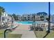 Resort-style pool featuring lounge chairs and umbrellas offers a relaxing outdoor oasis at 1012 Rosewood Ln, Mount Pleasant, SC 29464