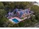 Expansive waterfront estate features a private pool, outdoor deck space, and lush landscaping, creating an idyllic coastal retreat at 108 Salthouse Ln, Kiawah Island, SC 29455
