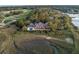 Expansive estate featuring a pool, dock, and stunning architecture nestled in a lush, natural setting at 108 Salthouse Ln, Kiawah Island, SC 29455
