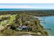 An aerial view showcases the waterfront property with a golf course nearby offering stunning ocean views at 108 Salthouse Ln, Kiawah Island, SC 29455