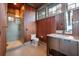Modern bathroom with a walk-in shower, wood paneling, and sleek vanity at 108 Salthouse Ln, Kiawah Island, SC 29455