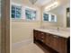Elegant bathroom featuring a double vanity with marble countertops and updated fixtures at 108 Salthouse Ln, Kiawah Island, SC 29455