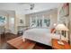 Cozy bedroom with ample natural light, hardwood floors, and a clean, minimalist design at 108 Salthouse Ln, Kiawah Island, SC 29455