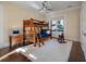 bedroom with wooden bunk beds, hardwood floors, and natural light from large windows at 108 Salthouse Ln, Kiawah Island, SC 29455