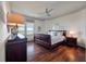Well-lit bedroom boasts hardwood floors, nautical decor and a large picture window with waterfront views at 108 Salthouse Ln, Kiawah Island, SC 29455
