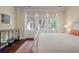 Bright bedroom featuring hardwood floors, French doors and neutral decor at 108 Salthouse Ln, Kiawah Island, SC 29455