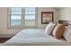 Bright bedroom detail showcases marsh views from the bed with designer pillows at 108 Salthouse Ln, Kiawah Island, SC 29455