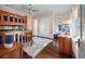 bedroom with wooden bunk beds, hardwood floors, and natural light from large windows at 108 Salthouse Ln, Kiawah Island, SC 29455