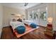 Shared bedroom featuring hardwood floors, natural light, and comfortable sleeping arrangements at 108 Salthouse Ln, Kiawah Island, SC 29455