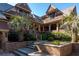 Beautiful home with stone steps, mature palm trees, and manicured shrubbery at 108 Salthouse Ln, Kiawah Island, SC 29455