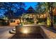 Beautiful home exterior with lush landscaping, brick accents, and inviting entryway at 108 Salthouse Ln, Kiawah Island, SC 29455