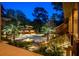 View of the home's exterior featuring a courtyard, driveway, and lush landscaping at 108 Salthouse Ln, Kiawah Island, SC 29455