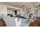 Spacious living room with hardwood floors, elegant furniture, and an open layout leading to the kitchen at 108 Salthouse Ln, Kiawah Island, SC 29455