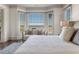 Bright main bedroom with bay windows offering scenic views, complemented by a comfortable sitting area at 108 Salthouse Ln, Kiawah Island, SC 29455