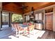 Covered patio featuring an outdoor kitchen, dining area, and picturesque outdoor views at 108 Salthouse Ln, Kiawah Island, SC 29455