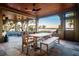 Charming covered patio with outdoor dining set, offering scenic water views and a relaxing atmosphere at 108 Salthouse Ln, Kiawah Island, SC 29455
