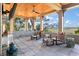 Inviting outdoor patio featuring comfortable seating and stunning waterfront views under a wood plank ceiling with fan at 108 Salthouse Ln, Kiawah Island, SC 29455