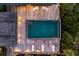 A stunning view of the rectangular pool and deck, featuring outdoor seating, chaise lounges, and nearby mature landscaping at 108 Salthouse Ln, Kiawah Island, SC 29455