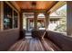 Covered porch with wood floors and ceiling, offering a comfortable outdoor space at 108 Salthouse Ln, Kiawah Island, SC 29455