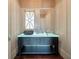 Stylish powder room features a unique glass sink and elegant lighting, adding a touch of modern luxury at 108 Salthouse Ln, Kiawah Island, SC 29455