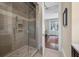 Stylish glass enclosed shower with tile surround, built-in niche and modern fixtures at 108 Salthouse Ln, Kiawah Island, SC 29455