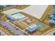 Beautiful aerial view of community amenities including the pool, playground, lake and common areas at 1081 Magnolia Warbler Way, Ravenel, SC 29470