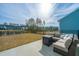 Cozy backyard patio with comfortable seating and a view of the surrounding community at 1081 Magnolia Warbler Way, Ravenel, SC 29470