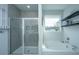 Bathroom with a shower, bathtub, and window offering natural light at 1081 Magnolia Warbler Way, Ravenel, SC 29470
