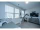 Bedroom featuring a gaming theme, a daybed, and plenty of natural light, perfect for a relaxing stay at 1081 Magnolia Warbler Way, Ravenel, SC 29470