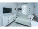 Serene bedroom with a cozy bed, sleek dresser, and soothing decor offers a relaxing and comfortable ambiance at 1081 Magnolia Warbler Way, Ravenel, SC 29470